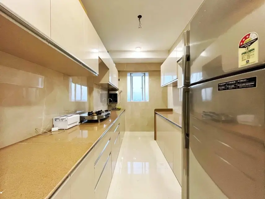 Shared kitchen facility in JB Nagar PG accommodation with essential appliances