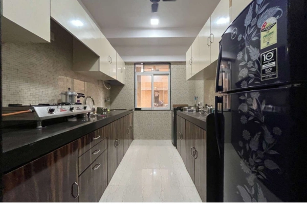 Furnished bedroom interior with study table and wardrobe at Millionaire Heritage Andheri West