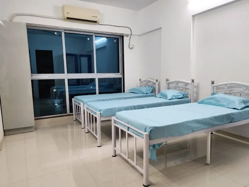 Four sharing PG hall with single beds, Parijat Tower