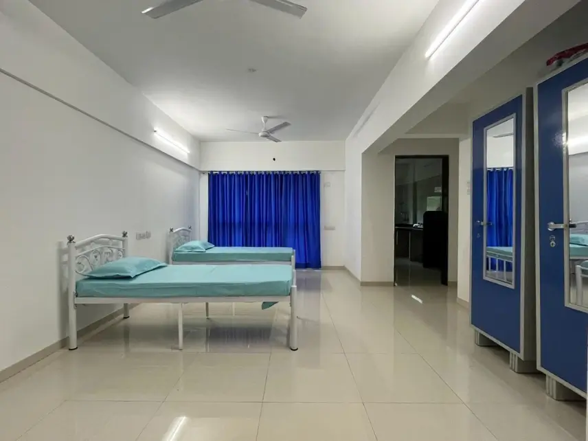 Four sharing PG hall with single beds, Parijat Tower